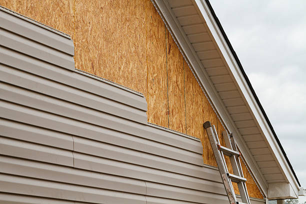 Professional Siding Replacement technician working in Coatesville, PA